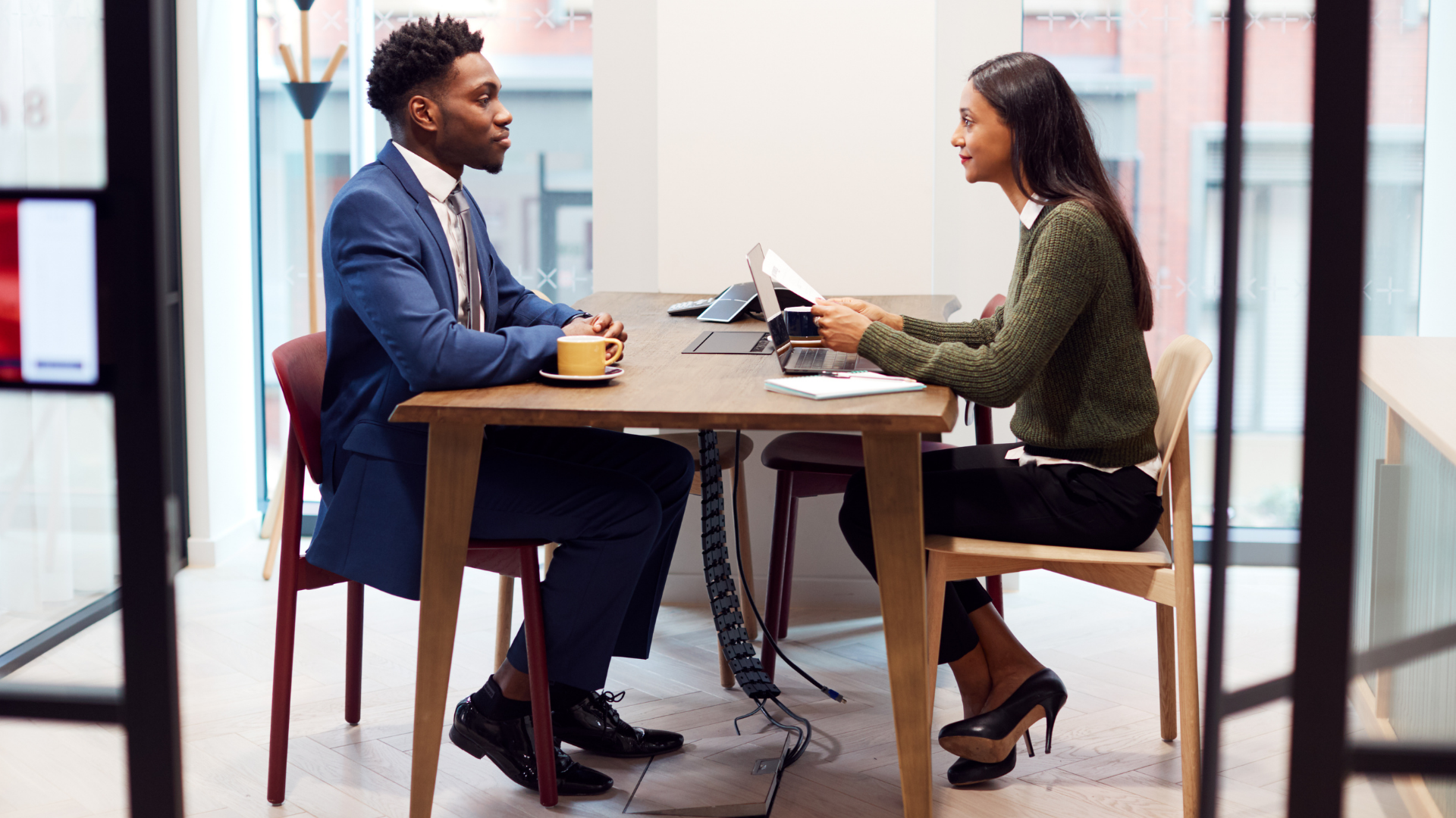 Two people in a one-to-one meeting